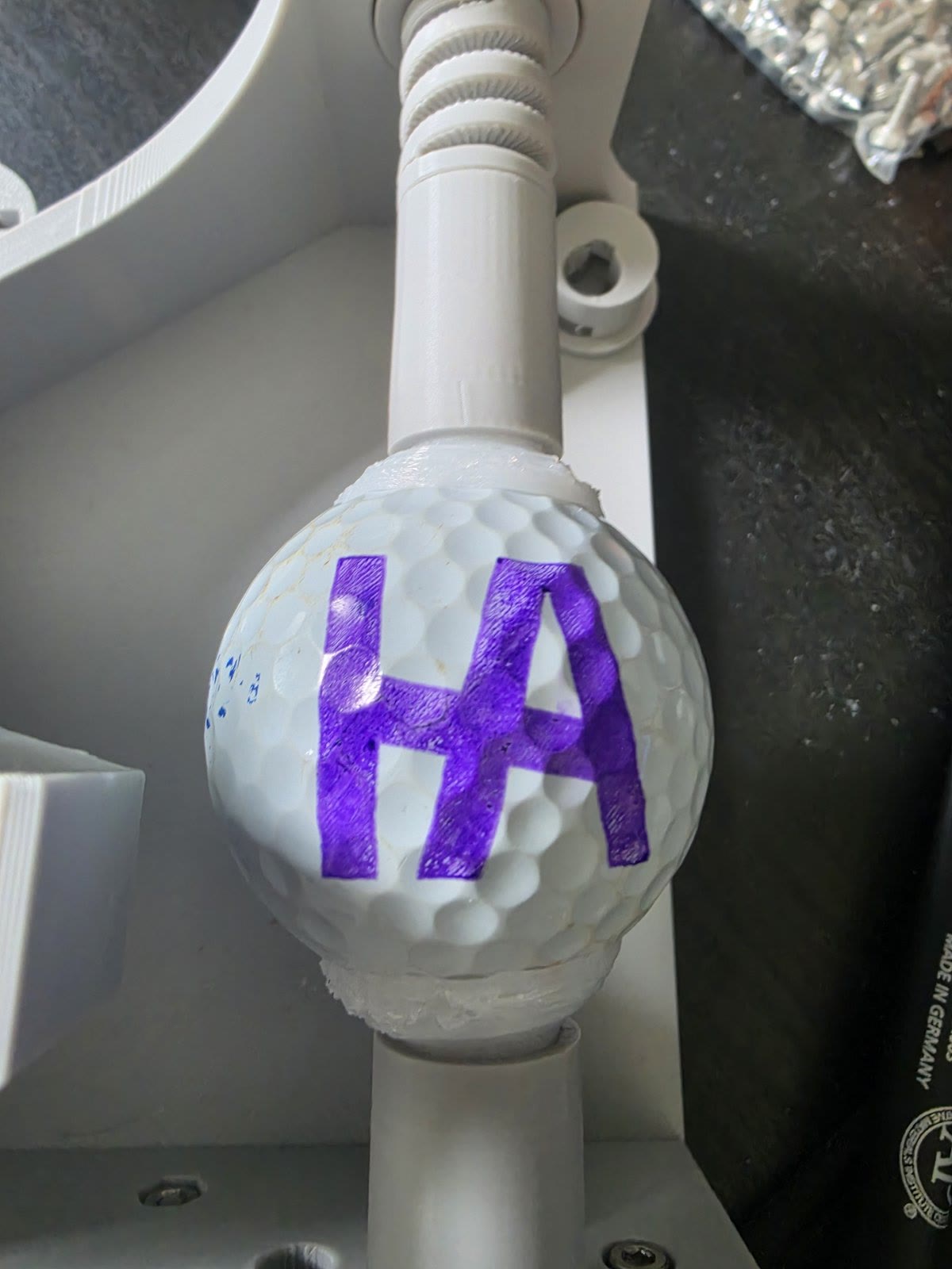 Improved HA logo test print on a golf ball after calibration and grip changes
