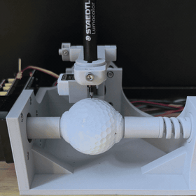 Timelapse of the DIY Golf Ball Plotter drawing directly onto a golf ball